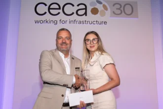 Gabriela receives the award from CECA Southern Chair, Kevin Valentine.