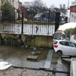 Bridge Road closed after vehicle strikes shop