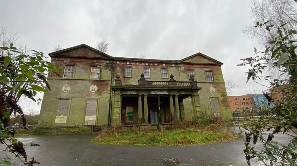 What is the history and origin of Woolton Hall in Liverpool?